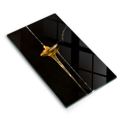 Tábua de cortar de vidro Uma colher de chá de mel