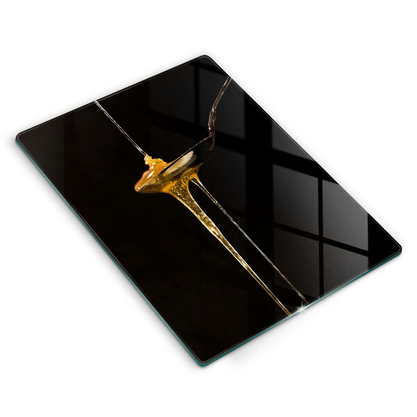 Tábua de cortar de vidro Uma colher de chá de mel