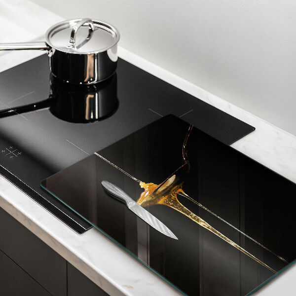 Tábua de cortar de vidro Uma colher de chá de mel