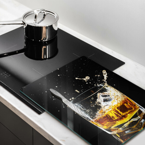 Tábua de corte de vidro Um copo de uísque