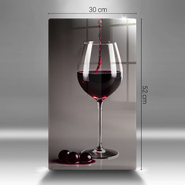 Tábua para corte Um copo e uvas