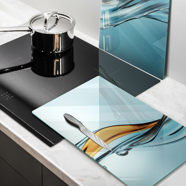 Tábua de vidro Água sobre fundo azul