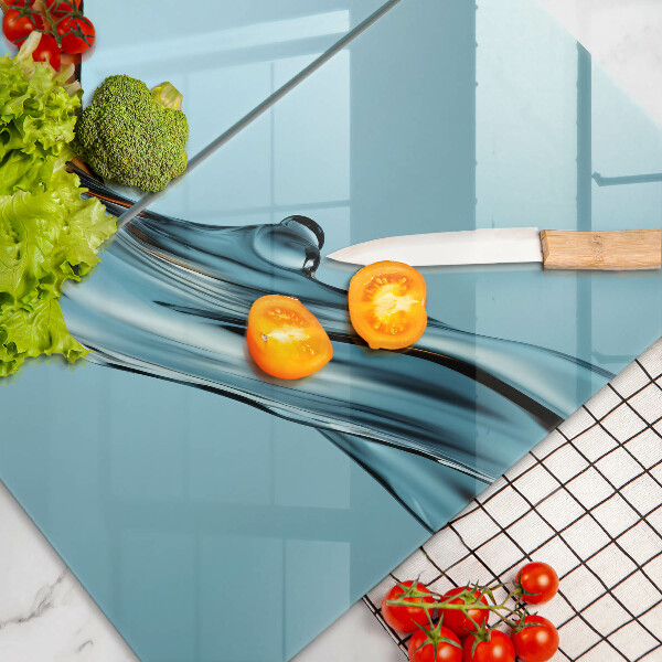 Tábua de vidro Água sobre fundo azul