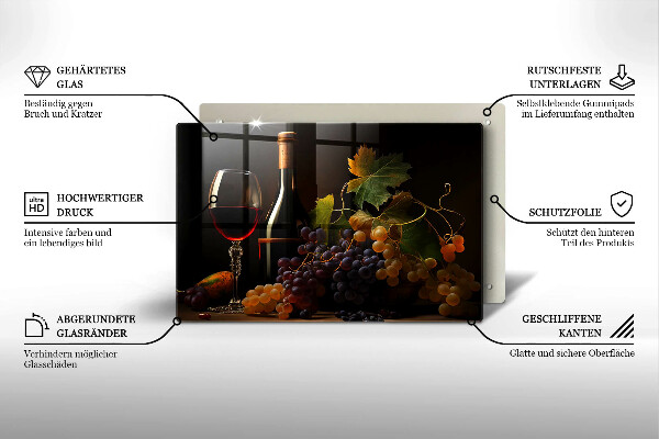 Tábua de cortar de vidro Um copo de vinho e uvas