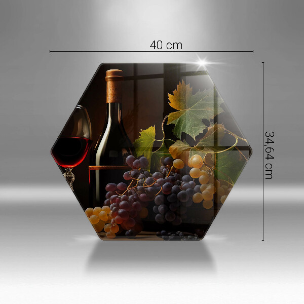 Tábua de corte de vidro Um copo de vinho e uvas