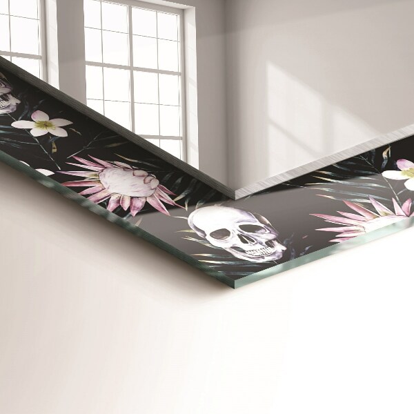 Espelho com moldura decorada de crânios e flores