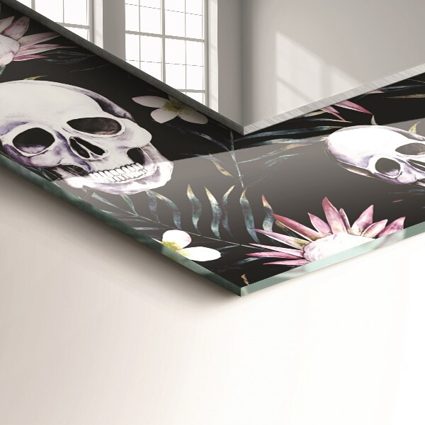 Espelho com moldura decorada de crânios e flores