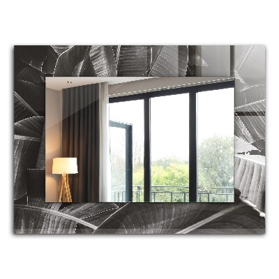 Espelho com moldura decorada com folhas de bananeira