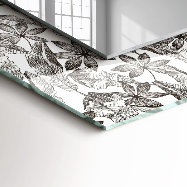 Espelho com moldura decorada em formato de folhas e flores
