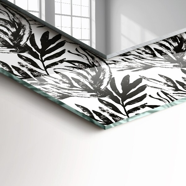 Espelho decorativo com estampa de folhas pretas e brancas