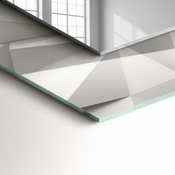 Espelho com moldura decorada de formas geométricas abstratas