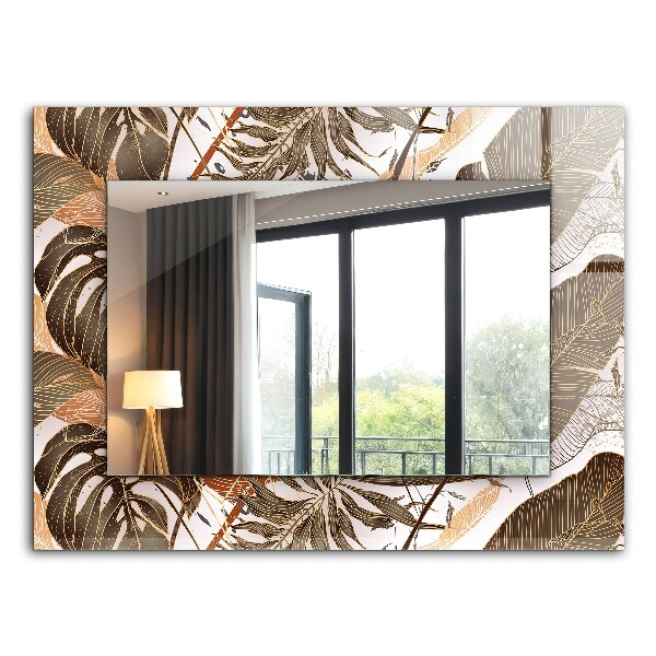 Espelho com moldura decorada com motivos de folhas tropicais