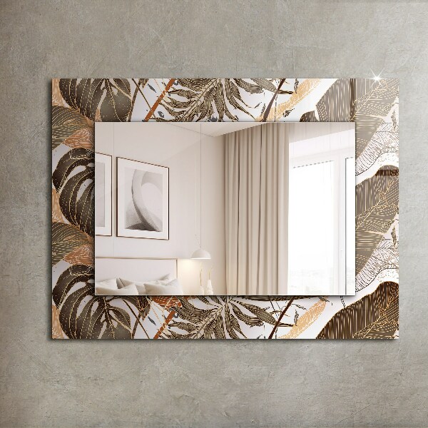 Espelho com moldura decorada com motivos de folhas tropicais