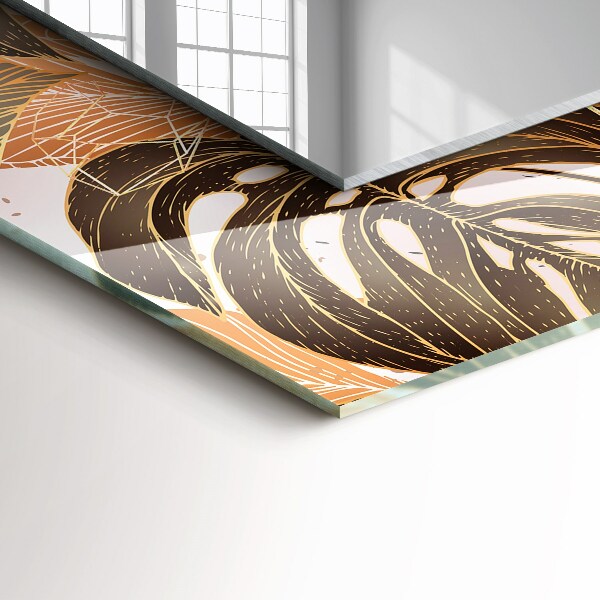 Espelho com moldura decorada com motivos de folhas tropicais