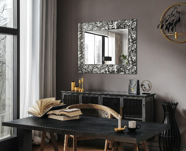 Espelho com moldura decorada em padrões preto e branco