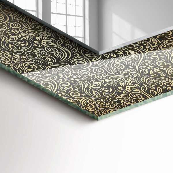Espelho decorativo com motivo em dourado