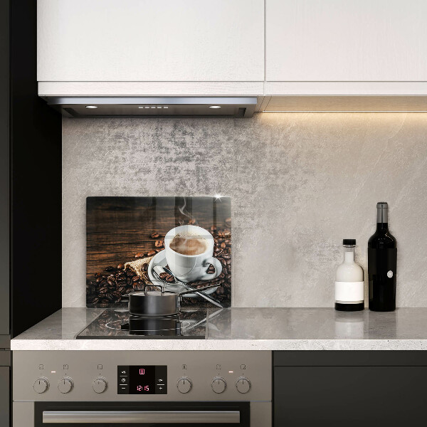 Cobertura de indução Uma xícara e grãos de café