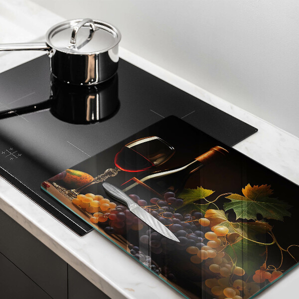 Tampa da placa de indução Um copo de vinho e uvas